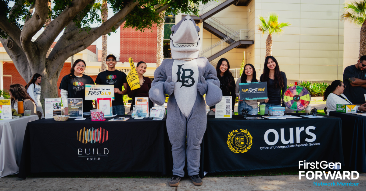 CalState Long Beach Row of Students at an info booth with the shark mascot at Celebration Day