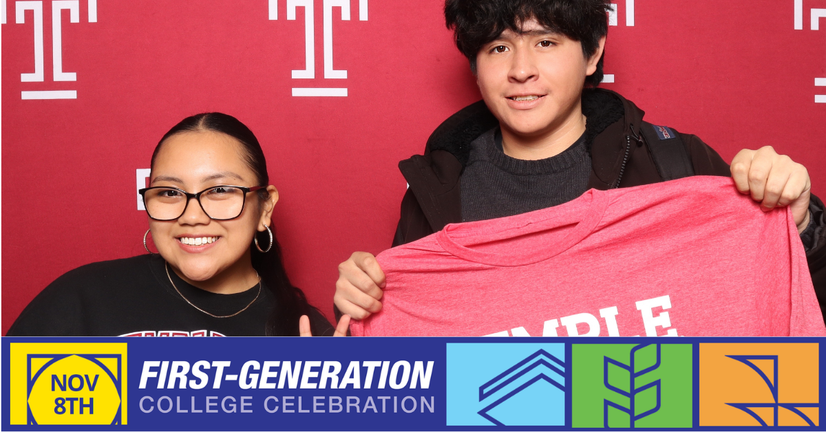Temple University Students smiling holding a red shirt that says temple