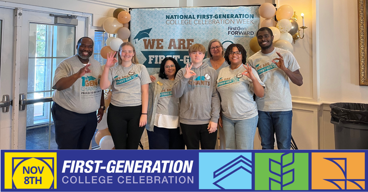Edwards College of Humanities and Fine Arts - T-shirt Distribution for Firstgen Students in front of banner holding up school hand symbol