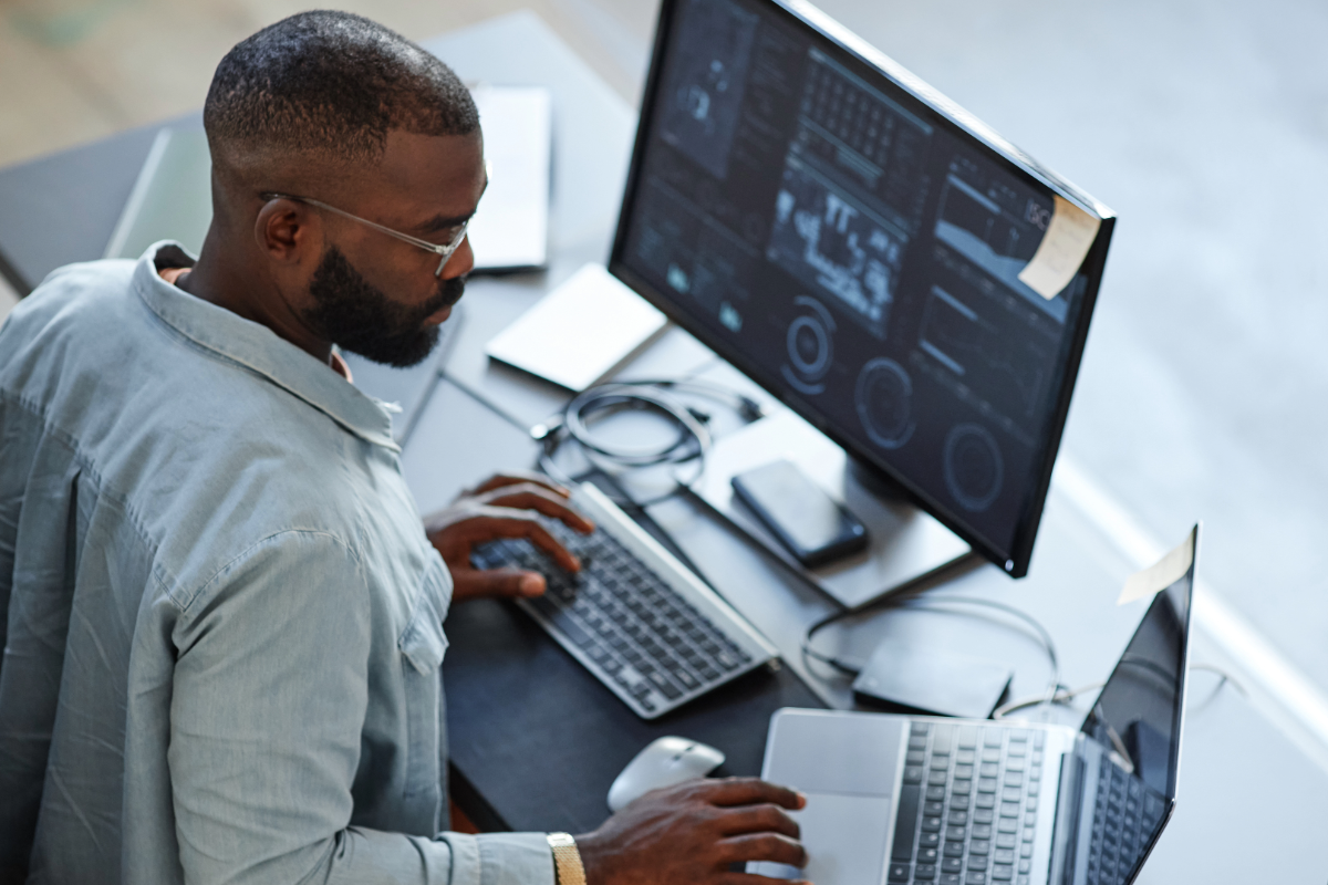 Man at Desk Reviewing Data